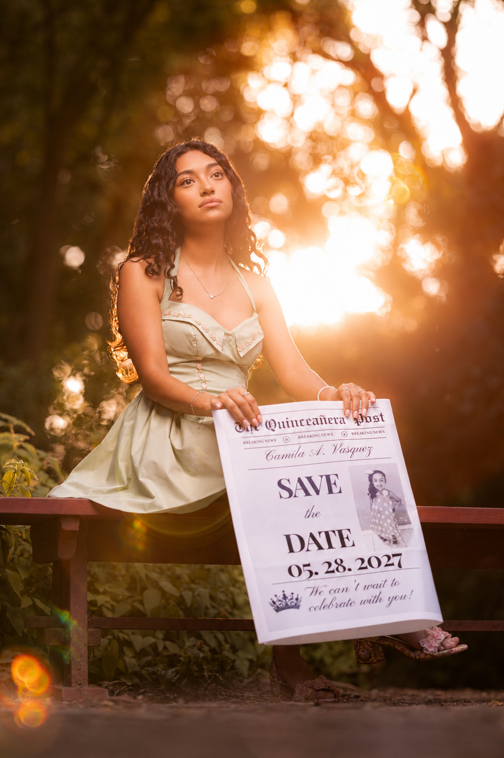 Camila at sunset holding the newspaper
